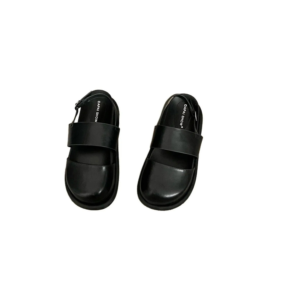 Retro women's sandals with a closed toe, ankle strap buckle, and platform sole in apricot colour.