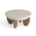 White adjustable height solid wood coffee table shown in a living room setting.