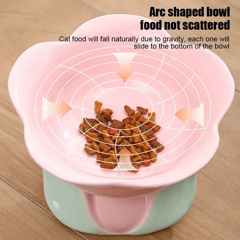 Blue ceramic pet bowl with floral pattern, raised on a non-slip base for cat or small dog feeding.