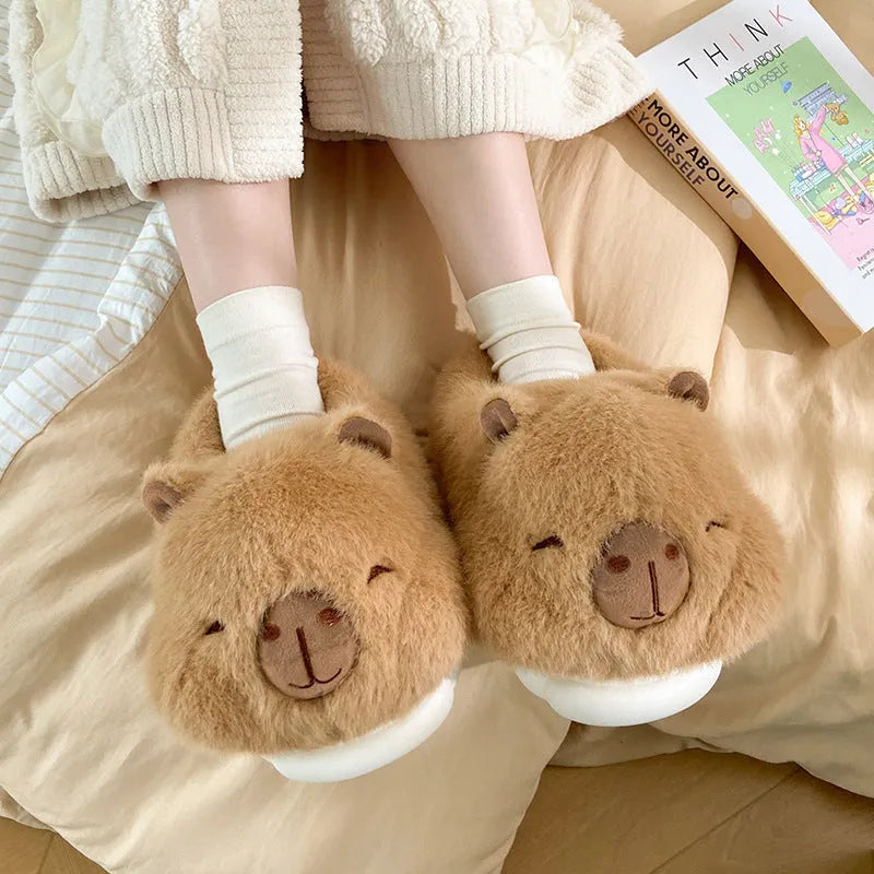 Light brown women's winter slippers with a cartoon pattern, plush upper, and wool lining.
