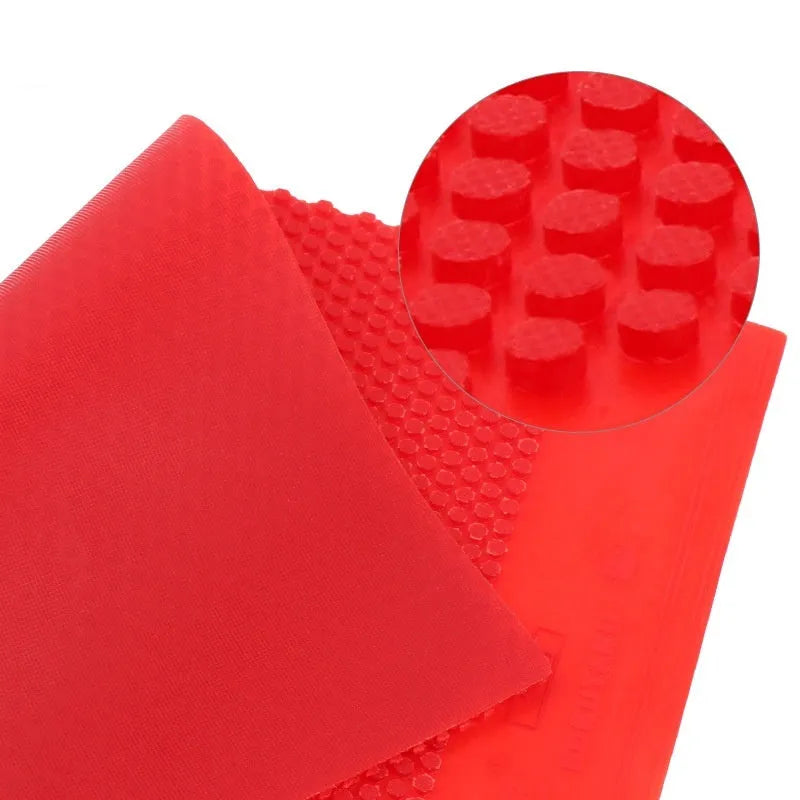 Single sheet of black table tennis rubber with small particle textured surface