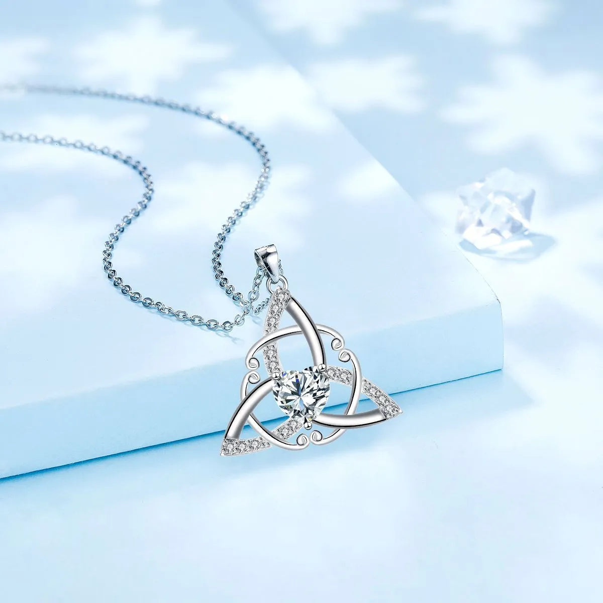 Women's Celtic knot necklace with geometric copper pendant in choice of four electroplated colours.