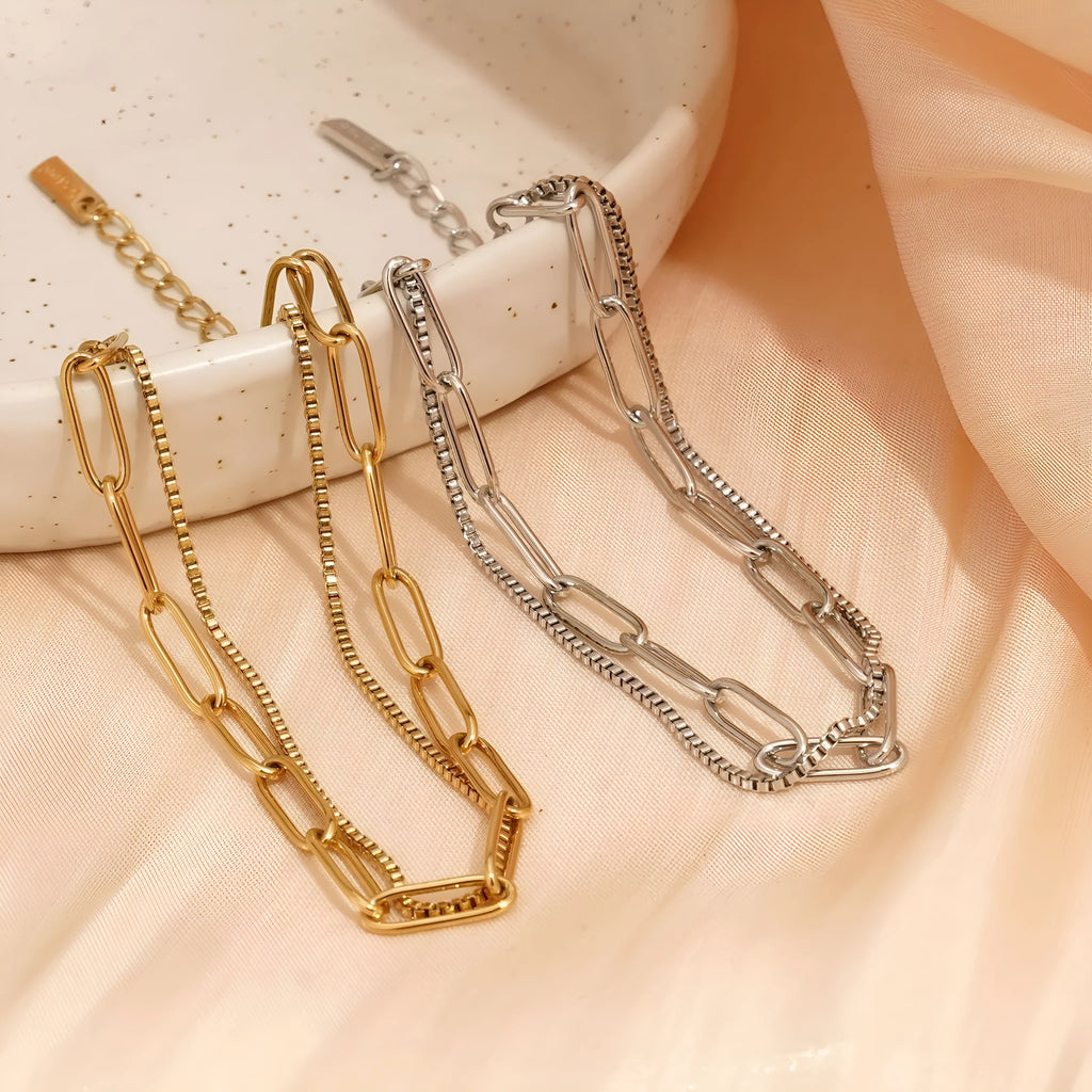 Double layer geometric stainless steel bracelet with linear elements in gold or silver electroplated finish