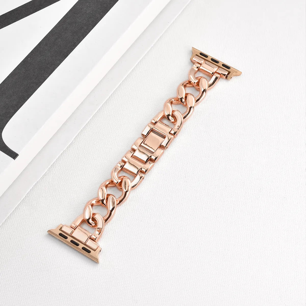 Metal chain link watch strap for Apple Watch in silver, black, gold, rose gold, or Starlight colour.