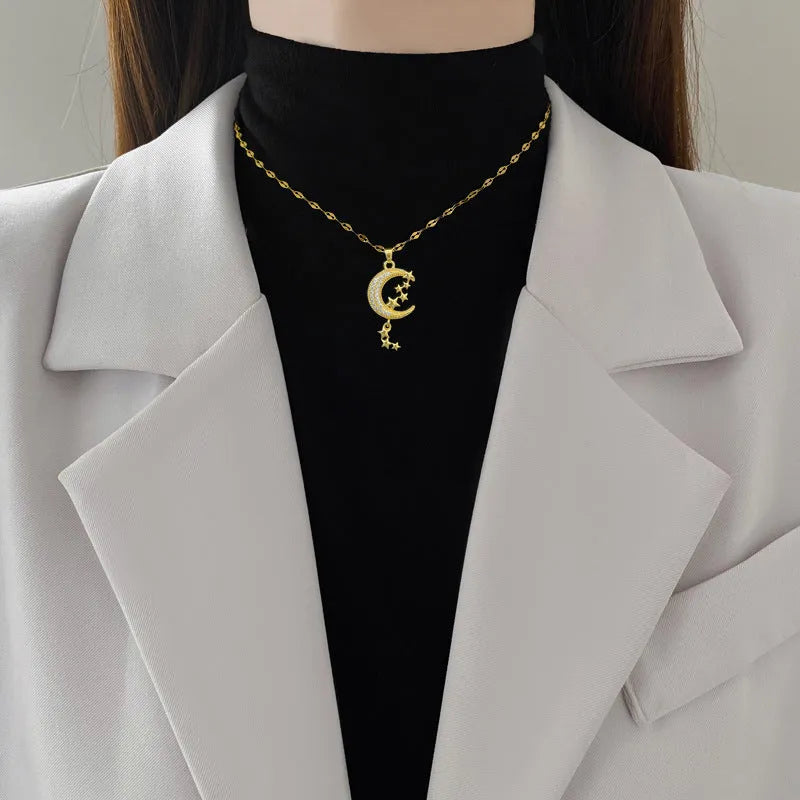 Moon pendant necklace with geometric tassel design and diamond embellishment on stainless steel chain