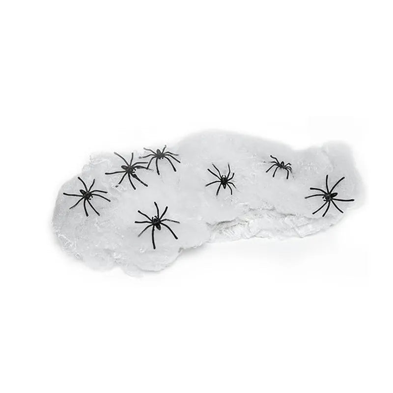 White cotton spider web Halloween decorations with spiders on dark background