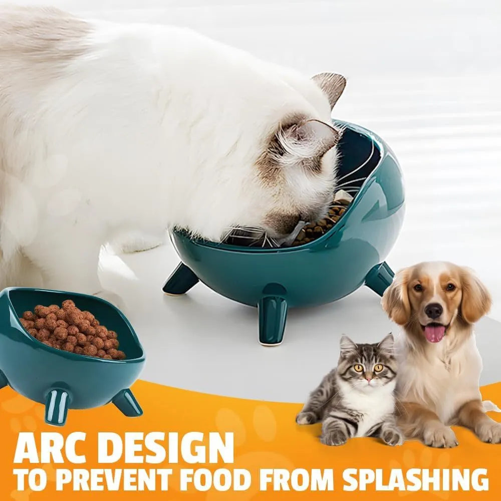 Green ceramic cat food bowl with four legs, wide mouth, and rounded arc shape on a light floor