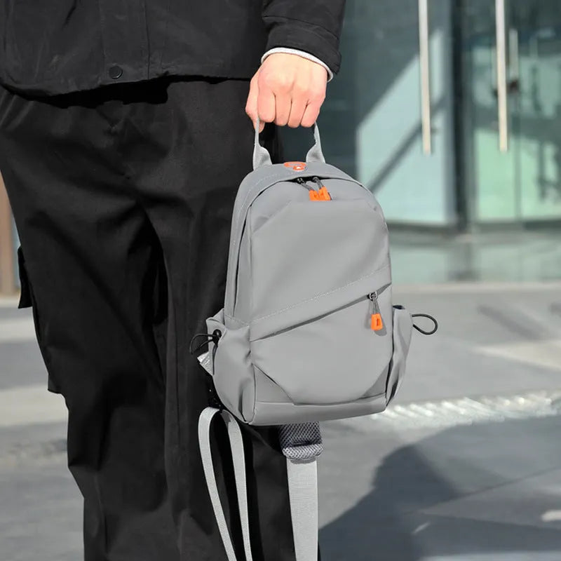 Men's black waterproof polyester crossbody bag with adjustable shoulder strap