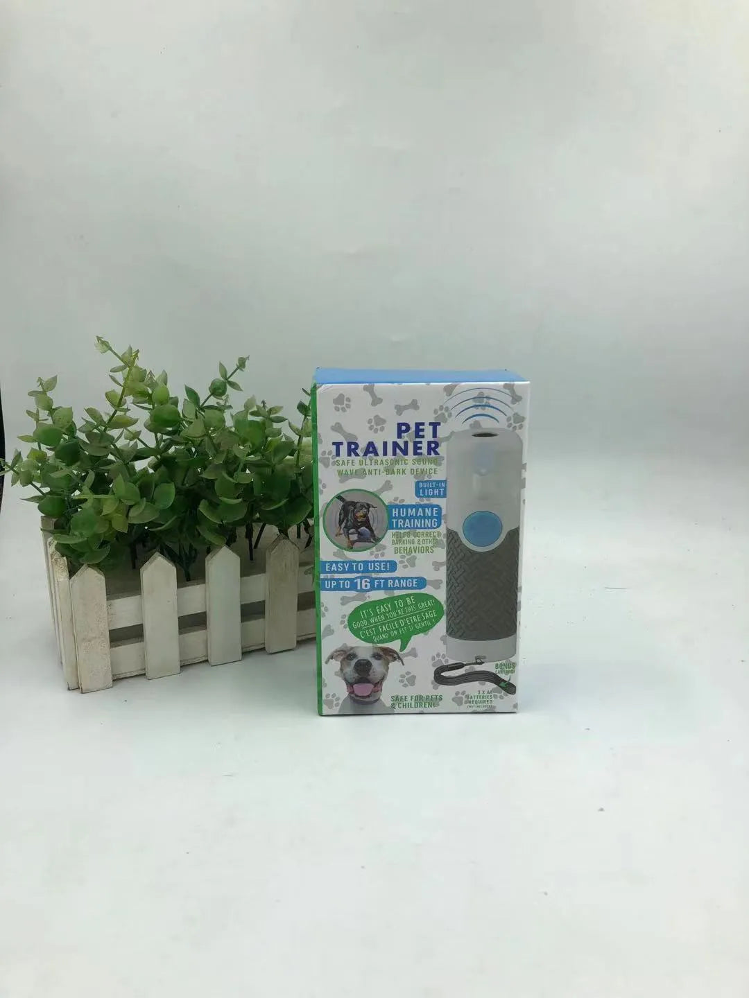 White handheld ultrasonic dog trainer device for bark control and behaviour correction