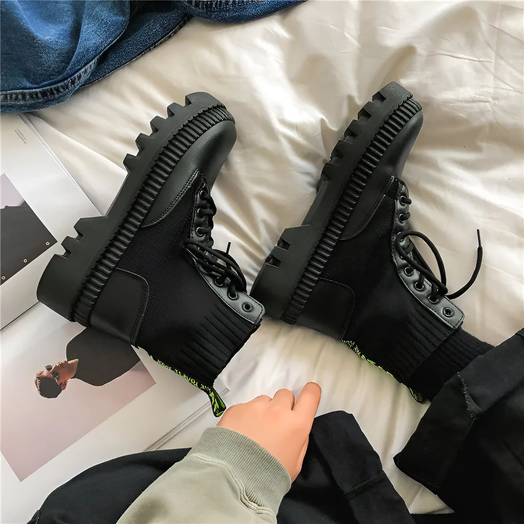 Men's black Doc Martens platform ankle boots with zip and frosted leather.