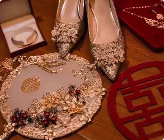 Champagne Xiuhe wedding shoes with rhinestones, pointed toe, fine heel, and one foot kick closure.