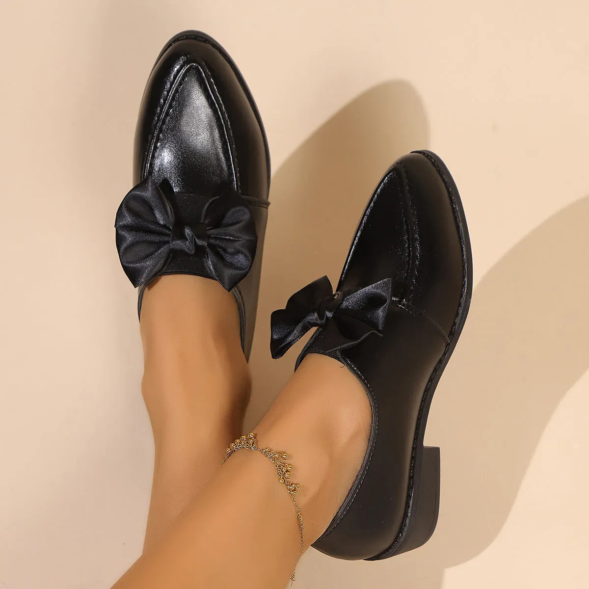 Women's flat shoes with a pointed toe and a choice of bow or buckle detail on the upper.