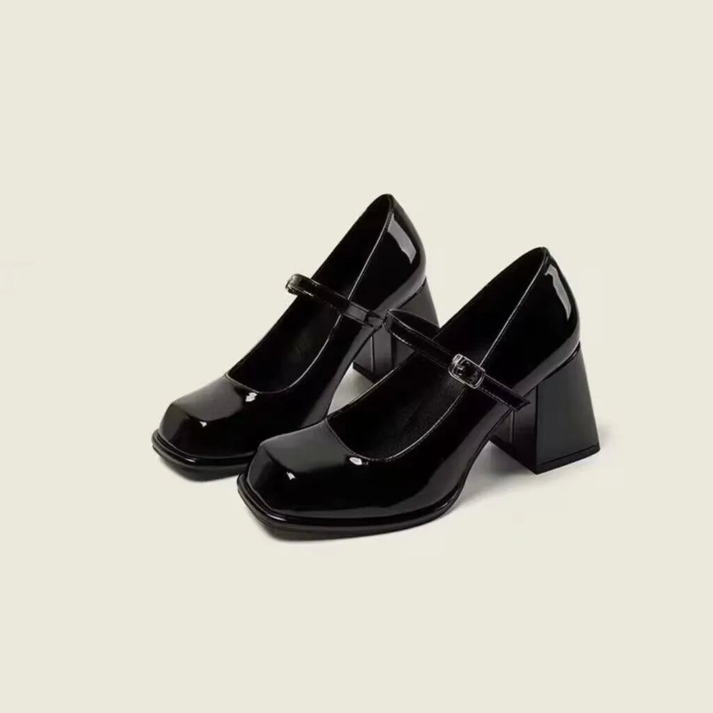 Women's retro black square toe chunky heel shoes with PU upper and buckle fastening on a white background