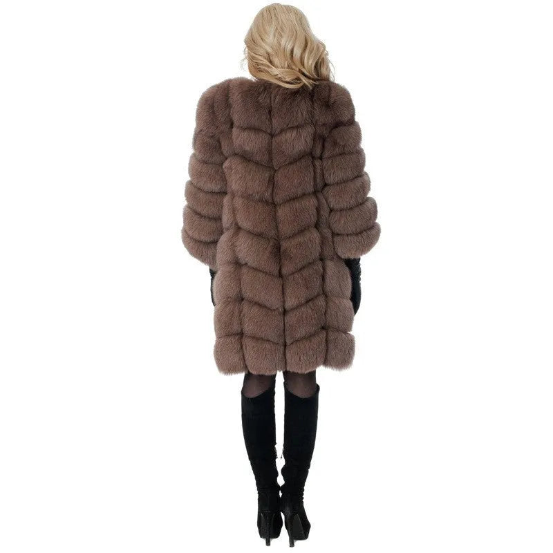 Women's long black faux fur coat with regular sleeves on a hanger