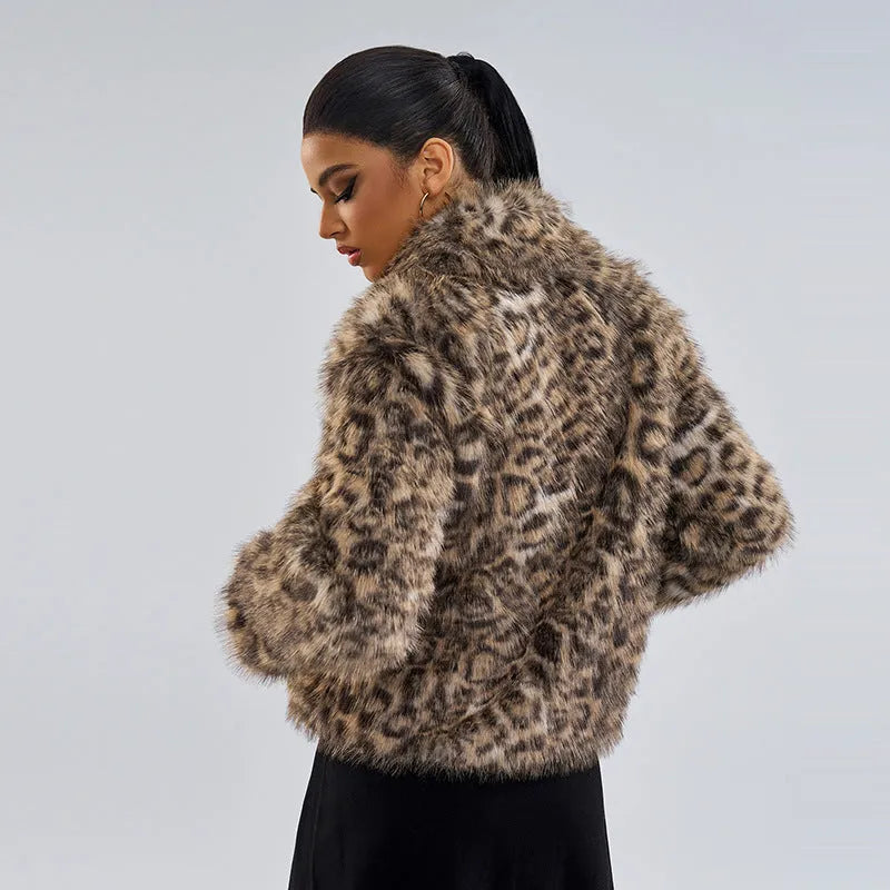 Leopard print women's coat with a buckle lapel fastening and regular sleeves.