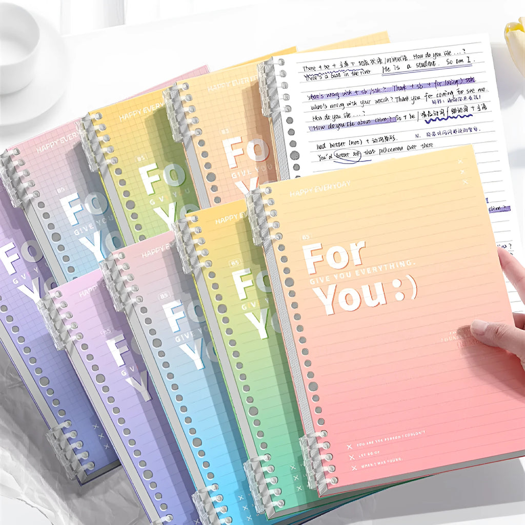 Removable coil notebook with gradient coloured PP plastic cover in blue, green, pink, or purple.