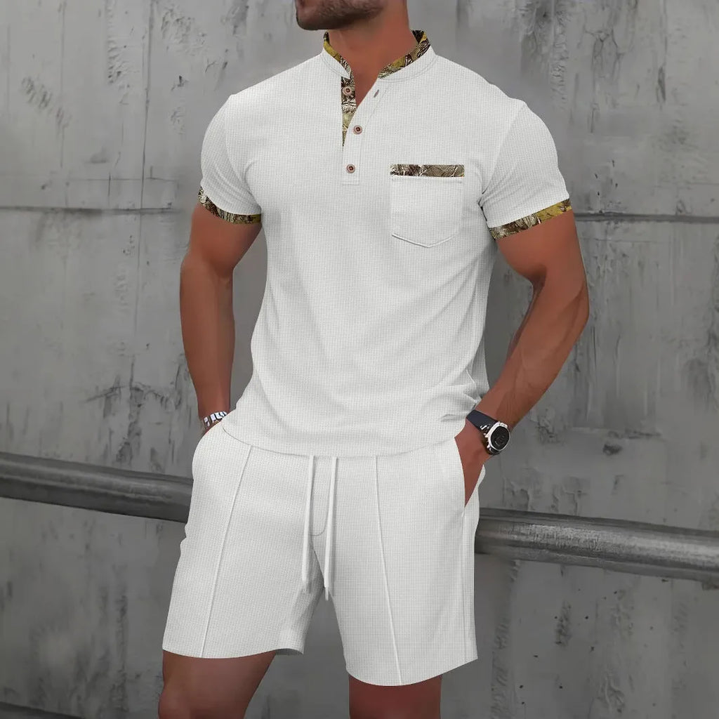 Men's grey sport suit with short sleeve polo collar top and matching shorts on mannequin