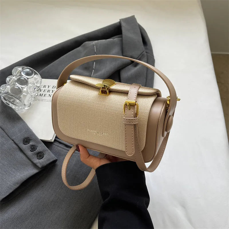 Women's PU messenger bag with lock and contrast stitching in rose pink colour, horizontal square shape