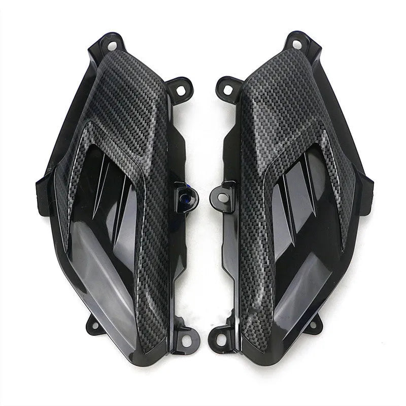Pair of YAMAHA NMAX motorcycle LED side lamps with ABS shell on a white background