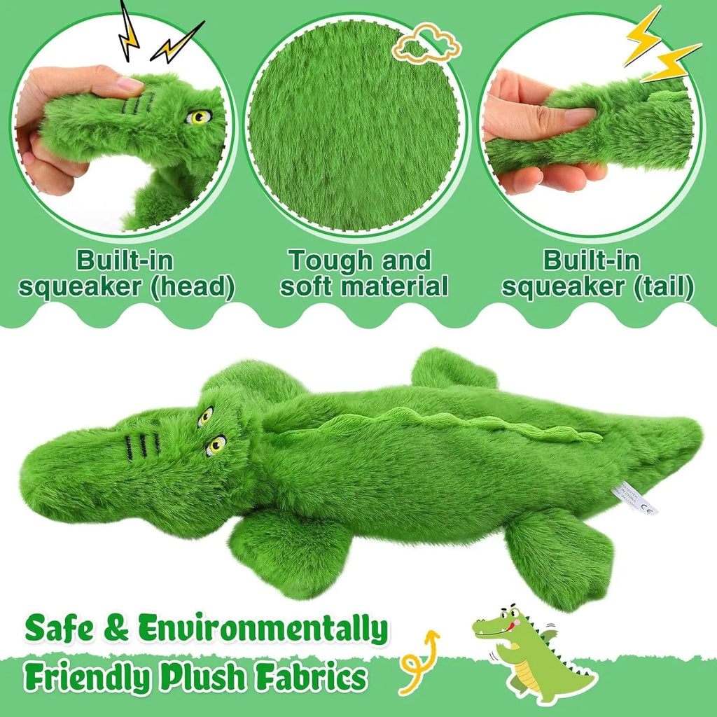 Green plush crocodile dog toy with no stuffing, featuring a squeaker head and crinkle paper tail.