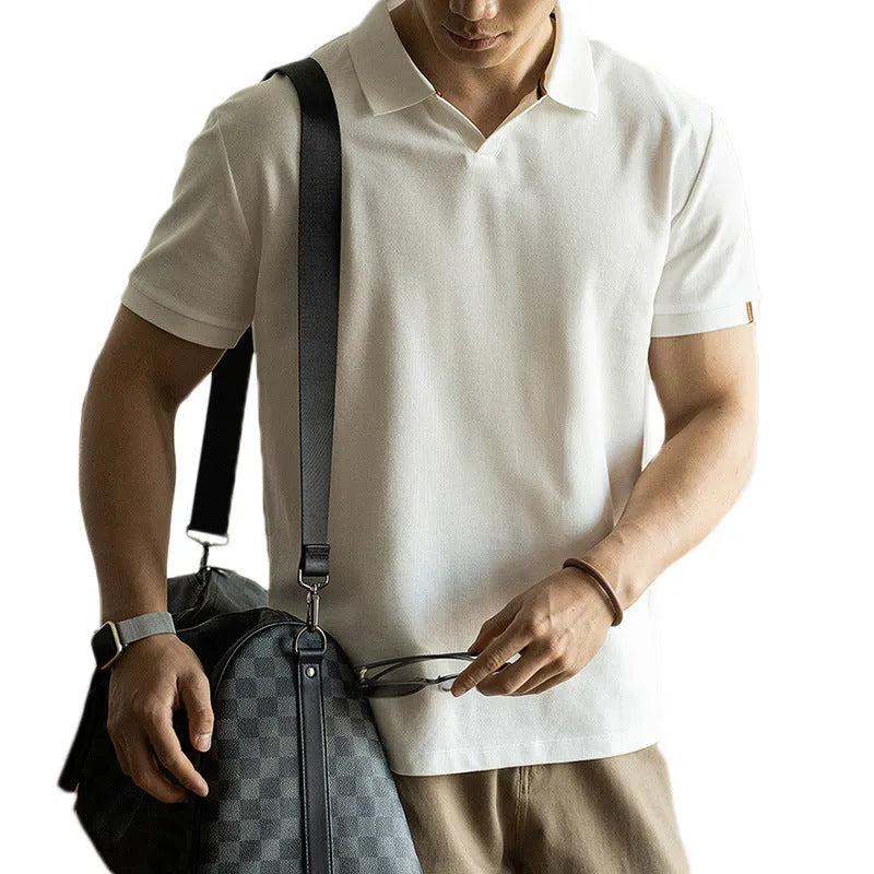 Men's short-sleeved blue polo shirt with a placket and collar, laid flat.