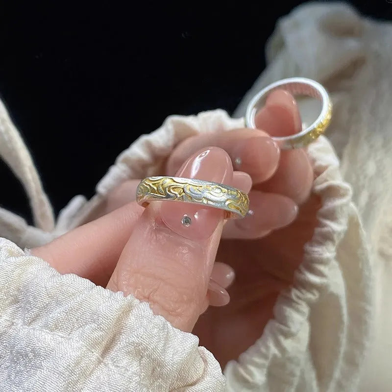 Geometric white copper open ring with silver and gold electroplated Xiangyun pattern.