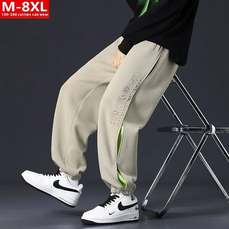 Men's cotton trousers with ankle bands and stitching detail in grey green colour