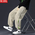 Men's cotton trousers with ankle bands and stitching detail in grey green colour