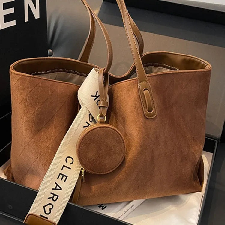 Large soft polyester shoulder bag in horizontal square shape with outer pocket, shown in light khaki colour.