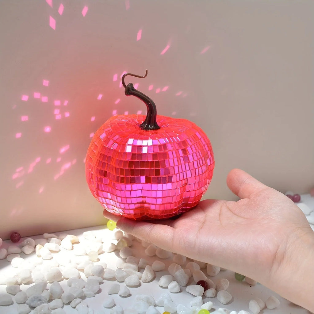 A detailed glass pumpkin decoration with embroidered finish, shown in multiple sizes for Halloween and Christmas.