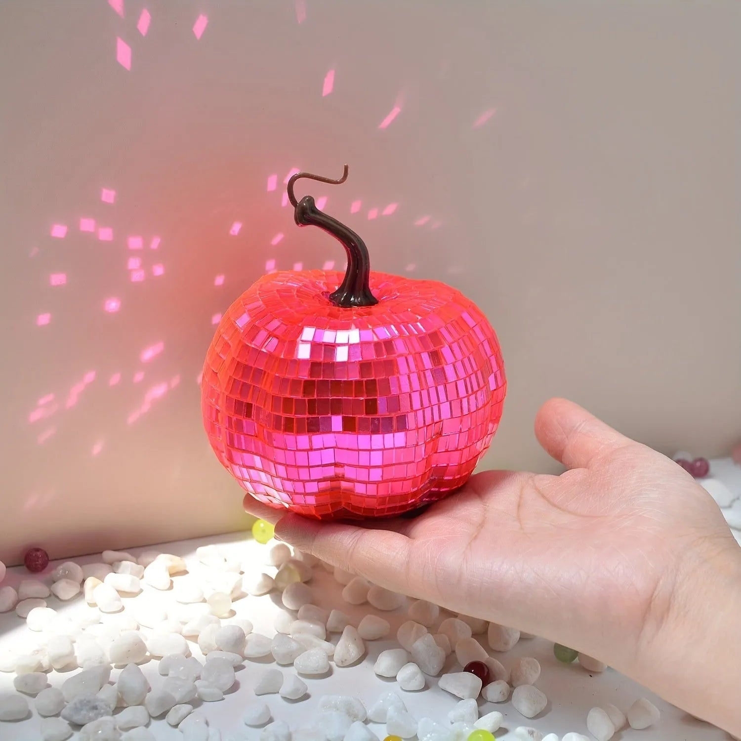 A detailed glass pumpkin decoration with embroidered finish, shown in multiple sizes for Halloween and Christmas.