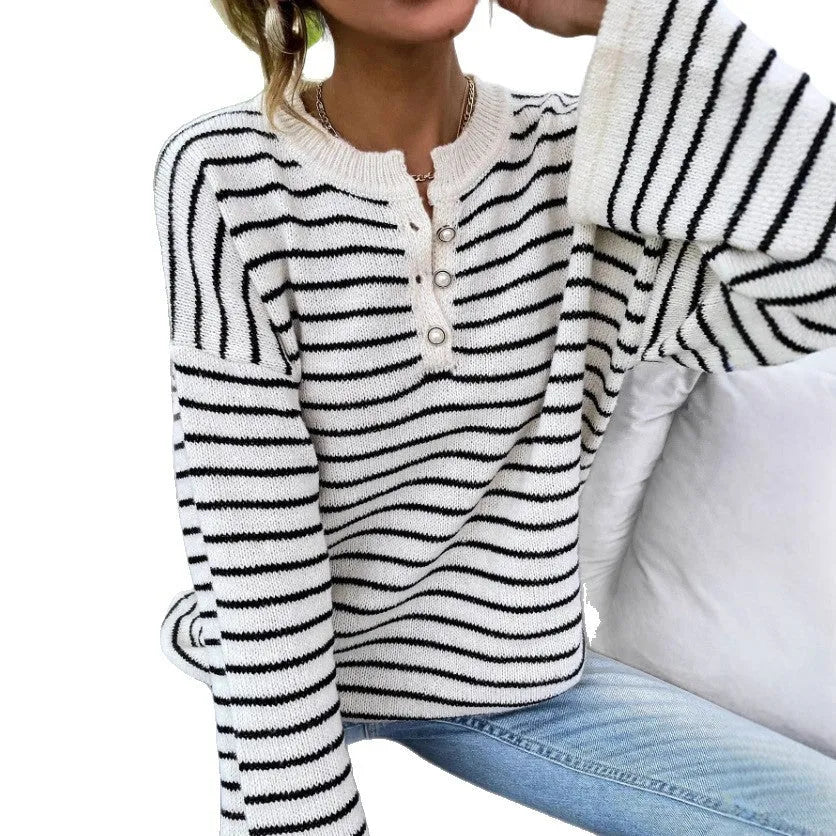 Black striped women's casual top with drop-shoulder sleeves and button detailing