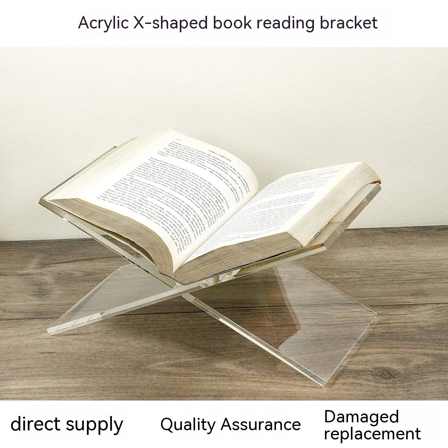 Clear acrylic X-shaped book reading rack holding an open book on a desk.