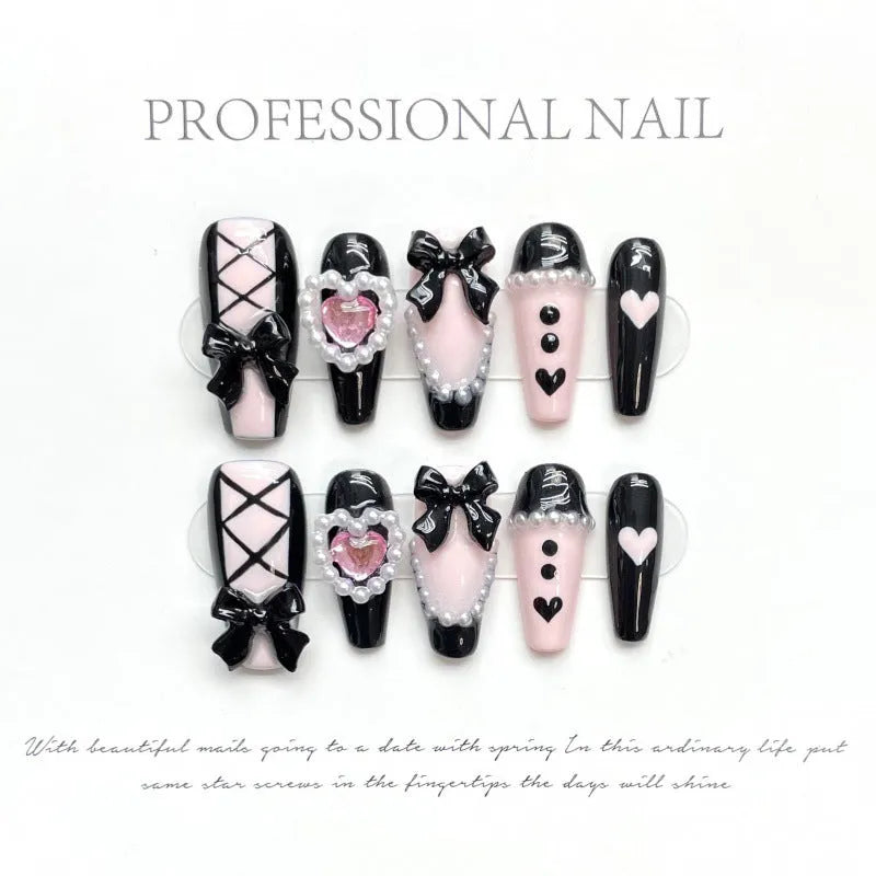 Black peach heart hand-painted artificial nails with cat's eye design in plastic storage case