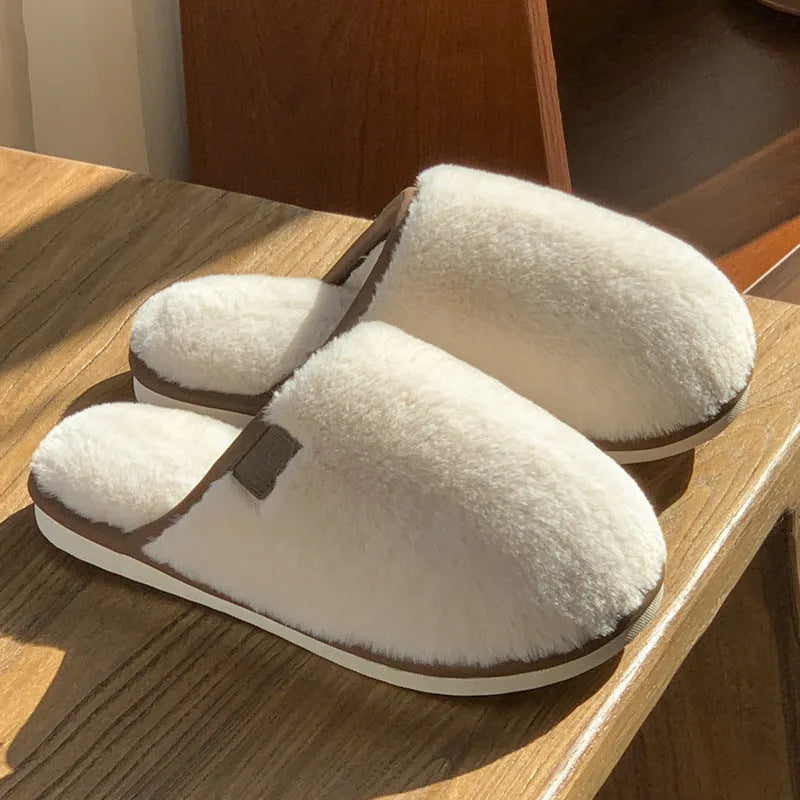 Solid colour PVC plush winter slippers for men and women on a home floor