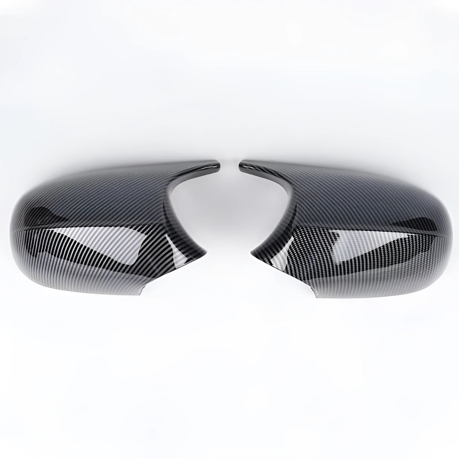 A pair of black and carbon pattern ABS plastic rearview mirror housing shells for a BMW 3 Series E90.