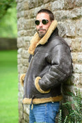 Brown retro synthetic leather fur coat for men, medium length with straight hem and side pockets.