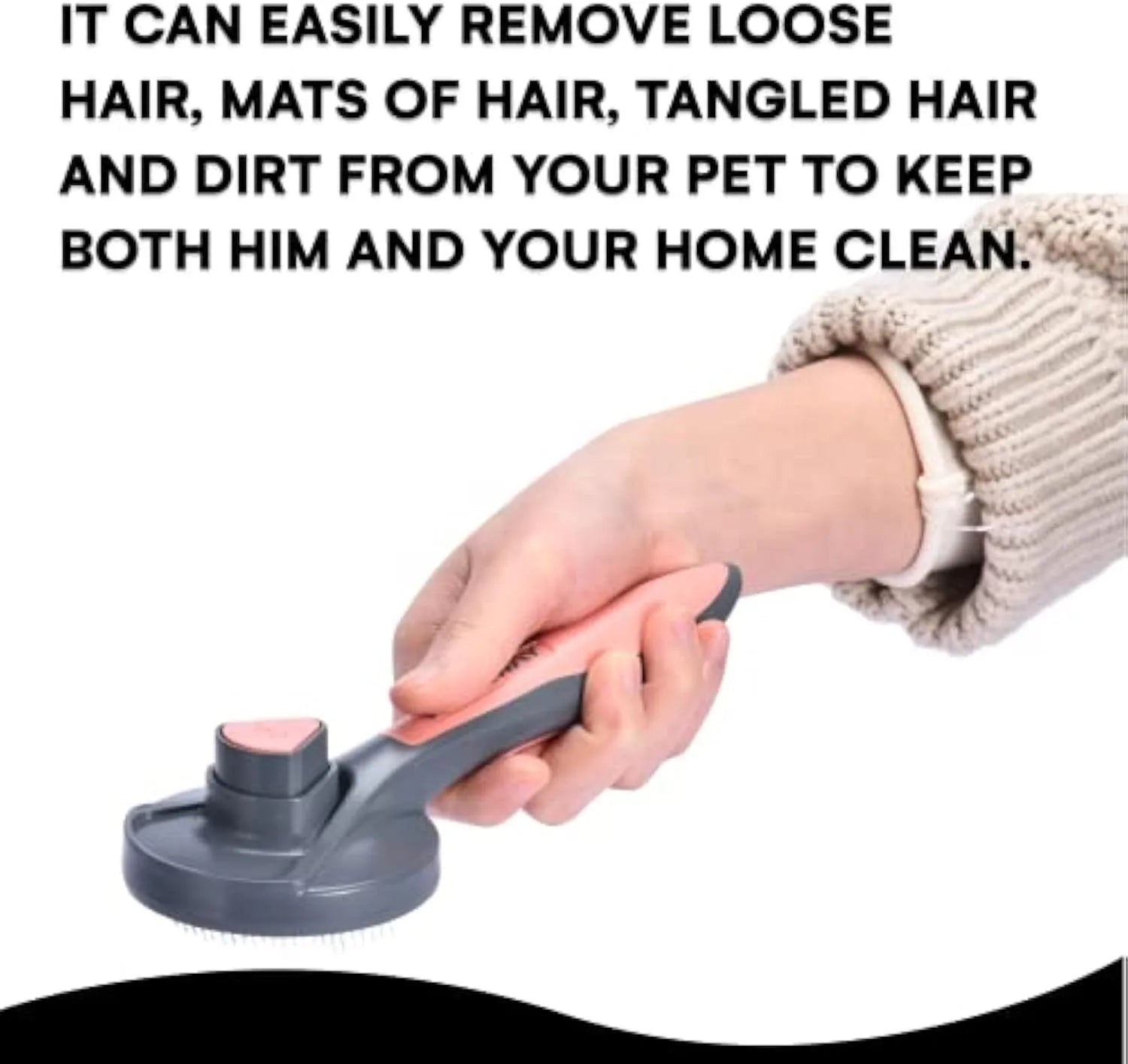 Grey self-cleaning slicker brush for pets with one-click button and comfort-grip handle on a table.