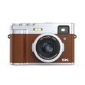 Black and brown 5K digital camera with dual lenses and optical viewfinder on display