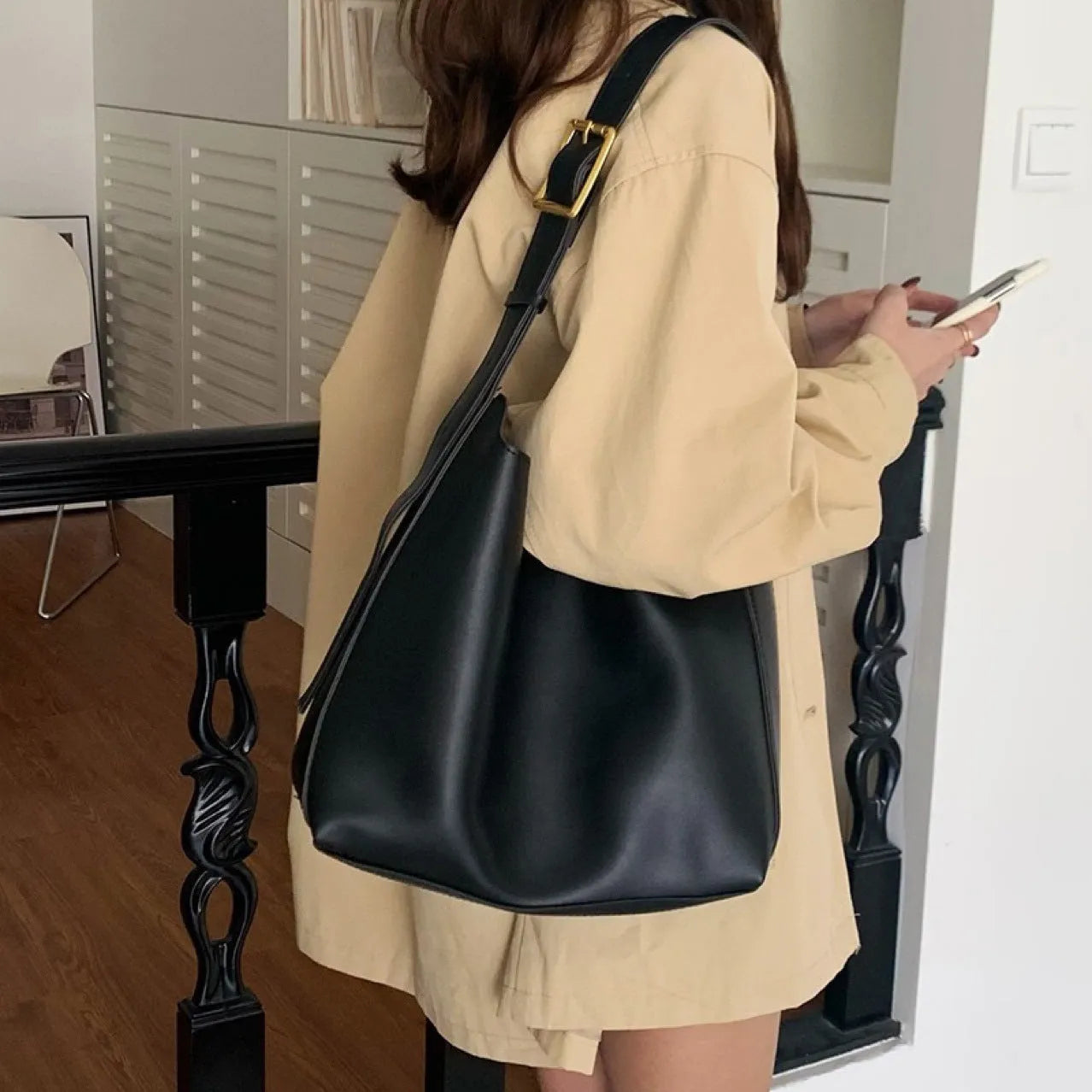 Pair of soft black and brown women's PU shoulder bags with decorative ribbons and swing threads.