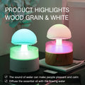White cloud-shaped humidifier with falling water droplets and coloured night light