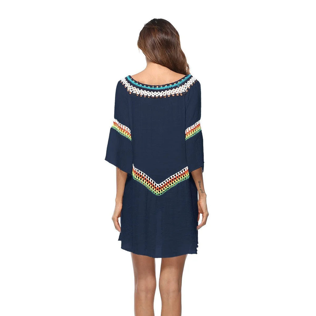 Crocheted ethnic style sun protection beach clothing for women in white, black, sapphire blue, or apricot.