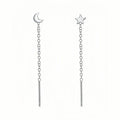 Sterling silver ear string with assorted small geometric and pearl charms on an alloy ear wire.