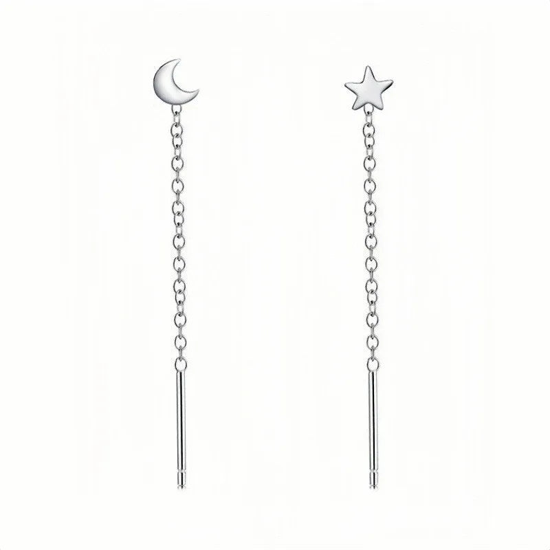 Sterling silver ear string with assorted small geometric and pearl charms on an alloy ear wire.