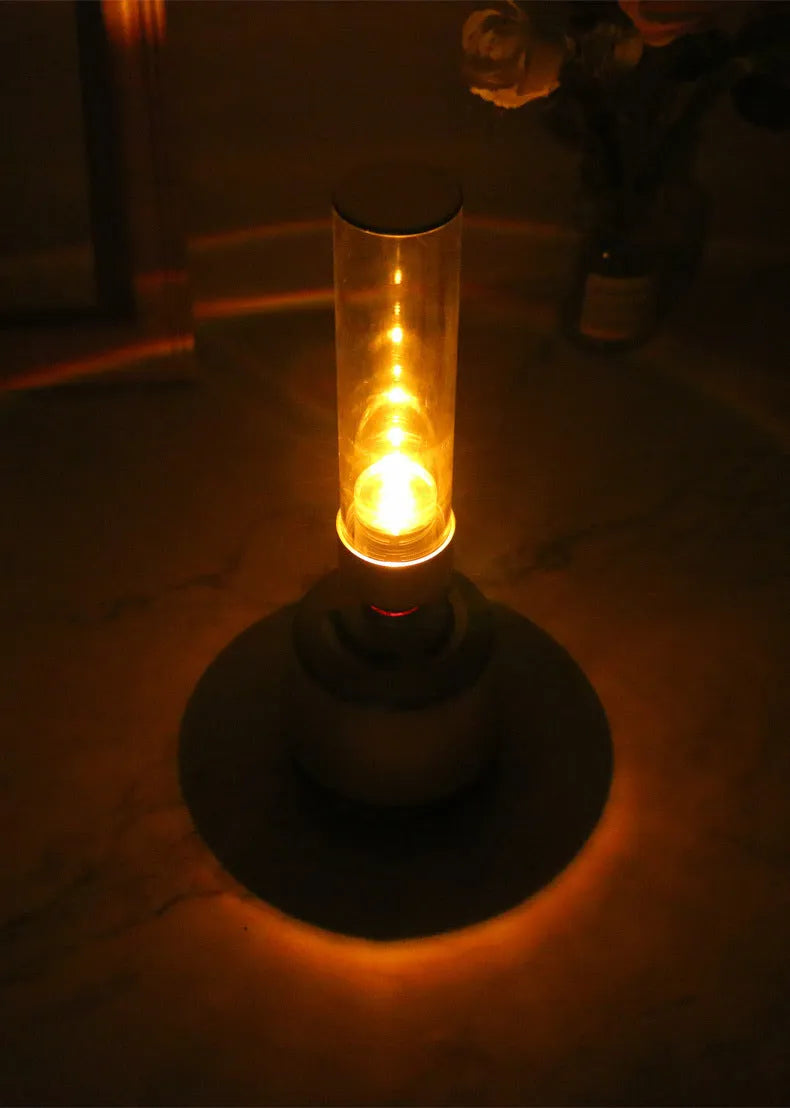 White silver Bluetooth speaker with candlelight atmosphere lighting showing modern minimalist design