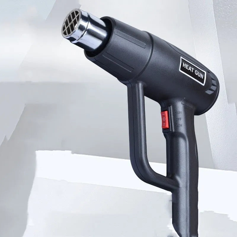 Black and silver industrial hot air gun with a grid-pattern nozzle and two-gear switch on the handle.