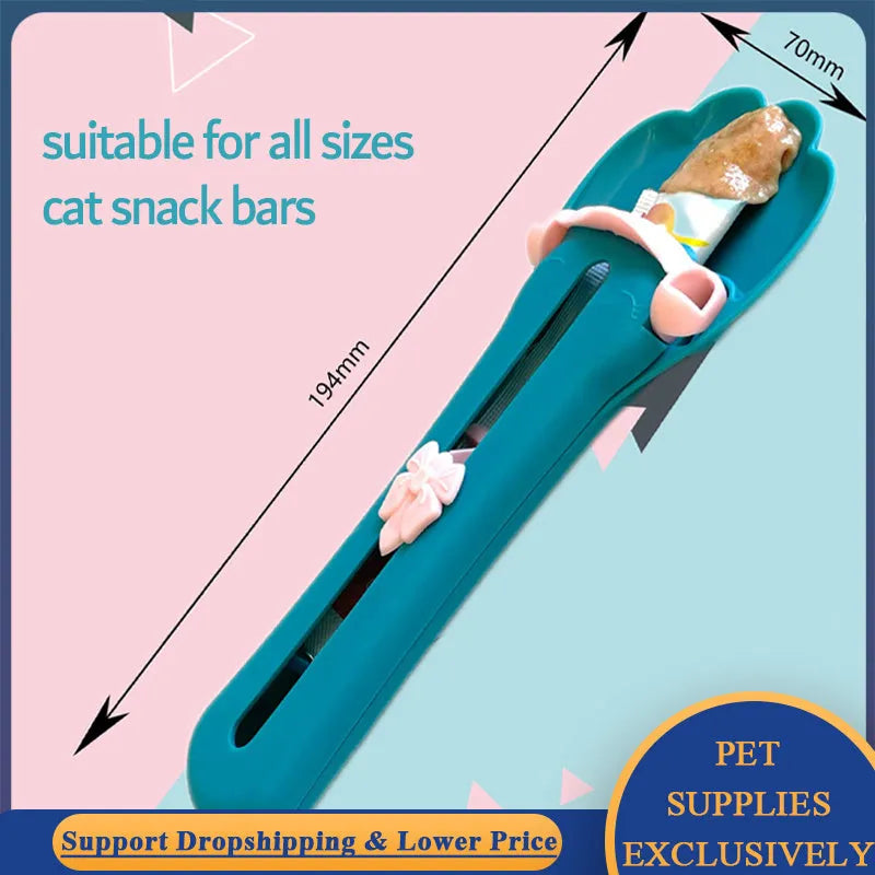 Green and pink pet food squeezer feeder scoop for cats and dogs.