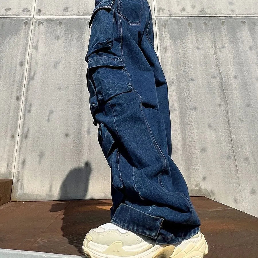 Women's dark blue distressed wide-leg high waist jeans with multiple pockets on a mannequin.