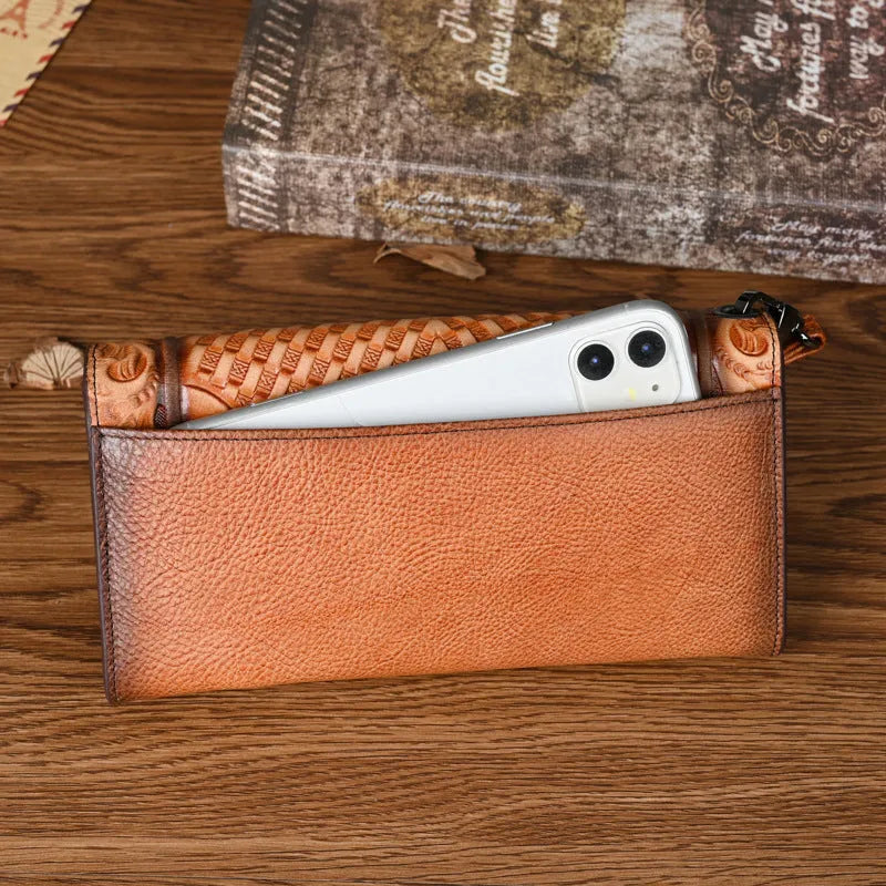 Retro brown tri-fold women's wallet with an embossed floral pattern, made from cowhide leather.