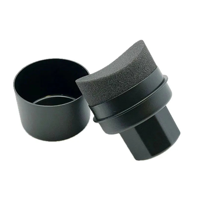 Black and red tyre polishing sponge brushes with PP handles and protective lids on a garage worktop